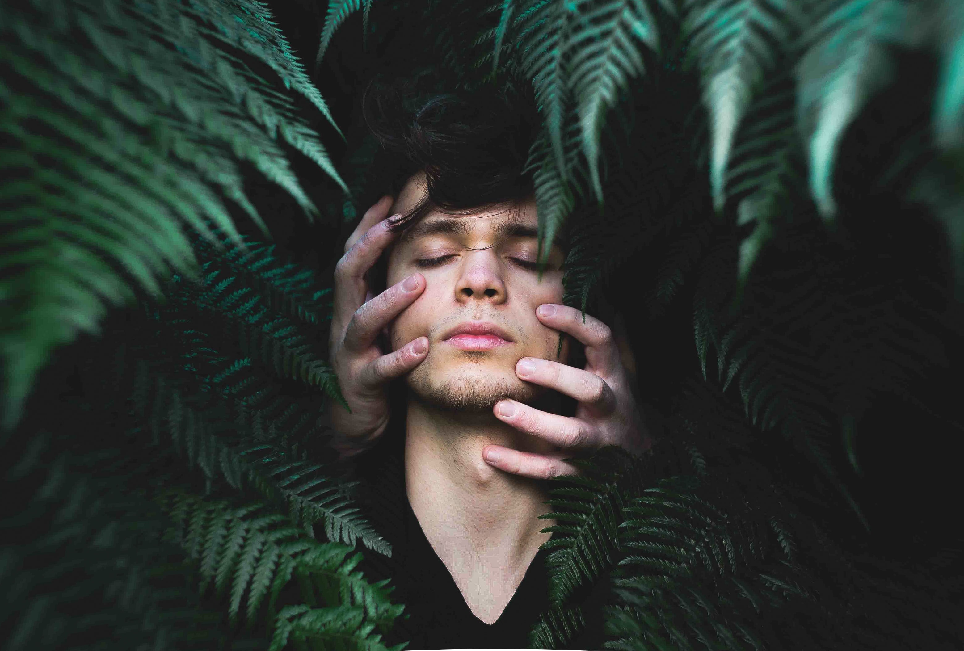 banner man with plants behind